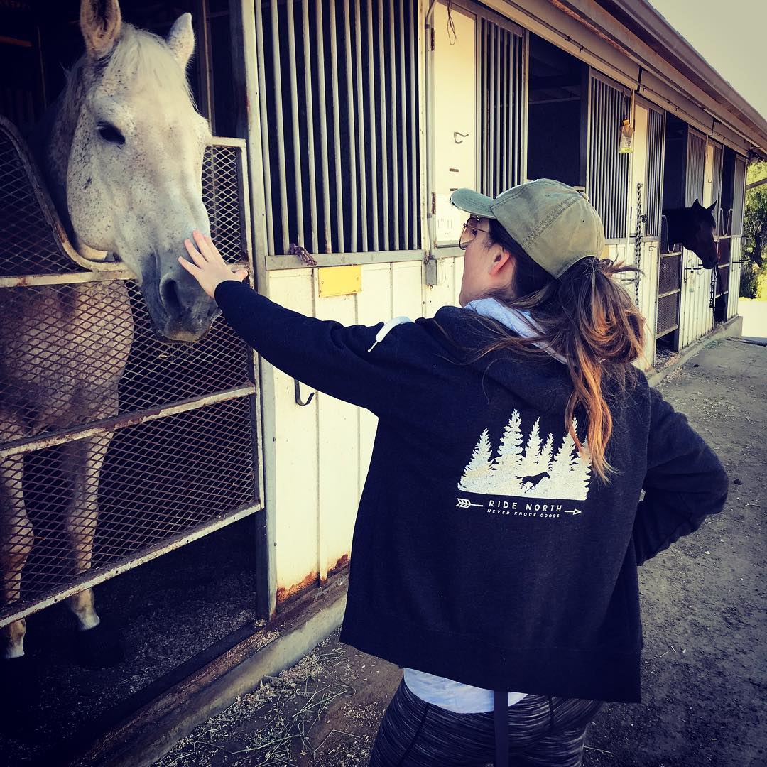 One of our clients rocking her Never Knock - Ride North Hoodie while strolling through horse country in California. 